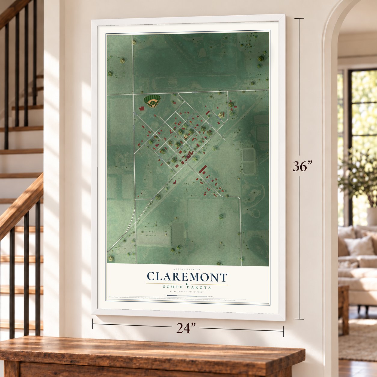 Claremont, South Dakota map, 24 x 36 inch print in a white frame by a staircase
