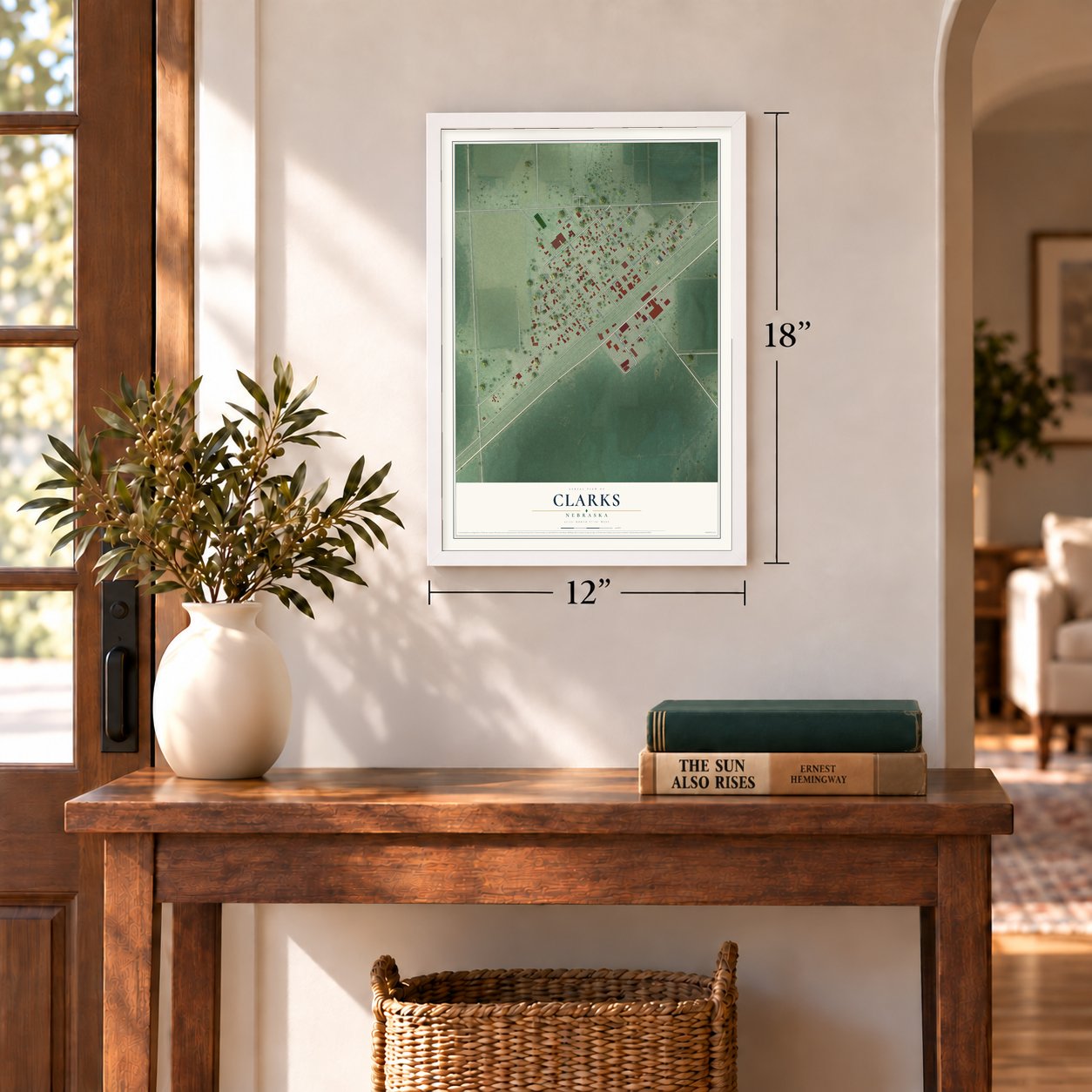 Clarks, Nebraska map, 12 x 18 inch print in a white frame in an entryway