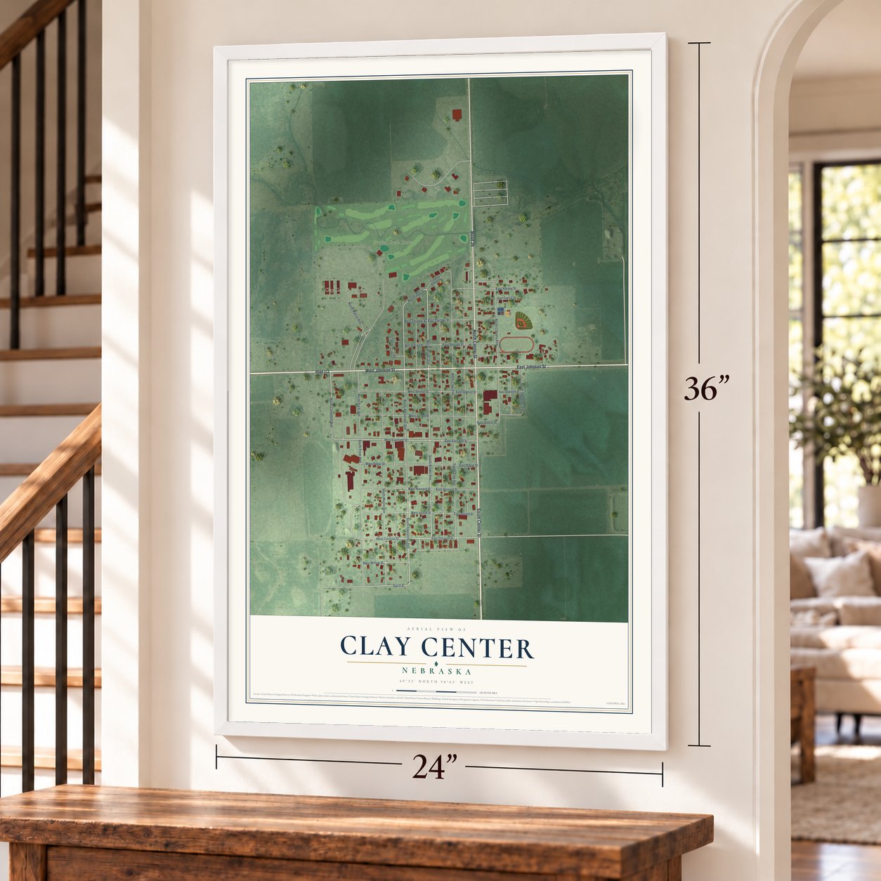 Clay Center, Nebraska map, 24 x 36 inch print in a white frame by a staircase
