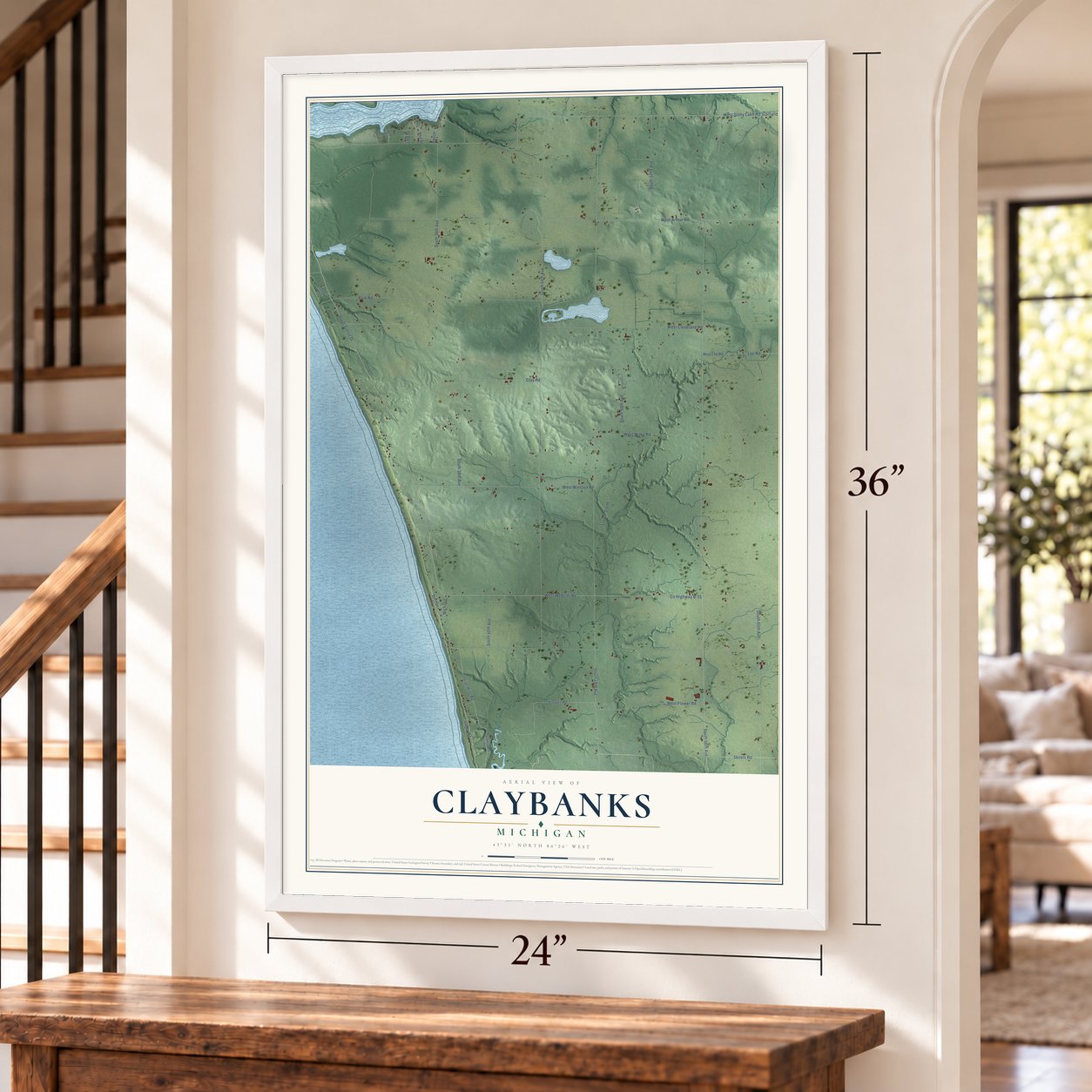 Claybanks, Michigan map, 24 x 36 inch print in a white frame by a staircase