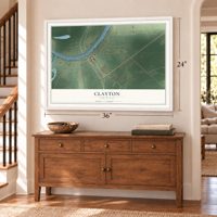 Clayton, Louisiana map, 24 x 36 inch print in a white frame above a dresser by a staircase