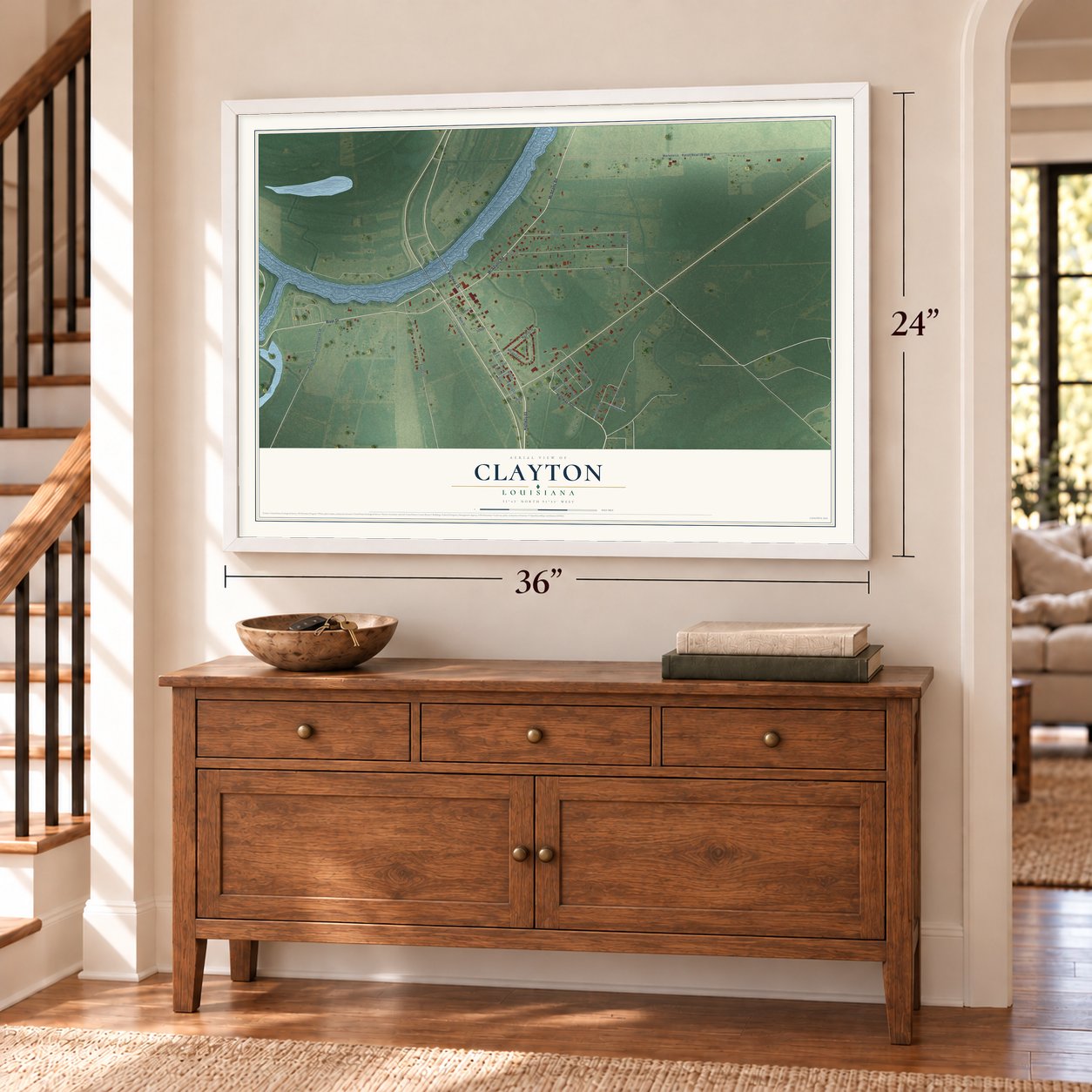 Clayton, Louisiana map, 24 x 36 inch print in a white frame above a dresser by a staircase