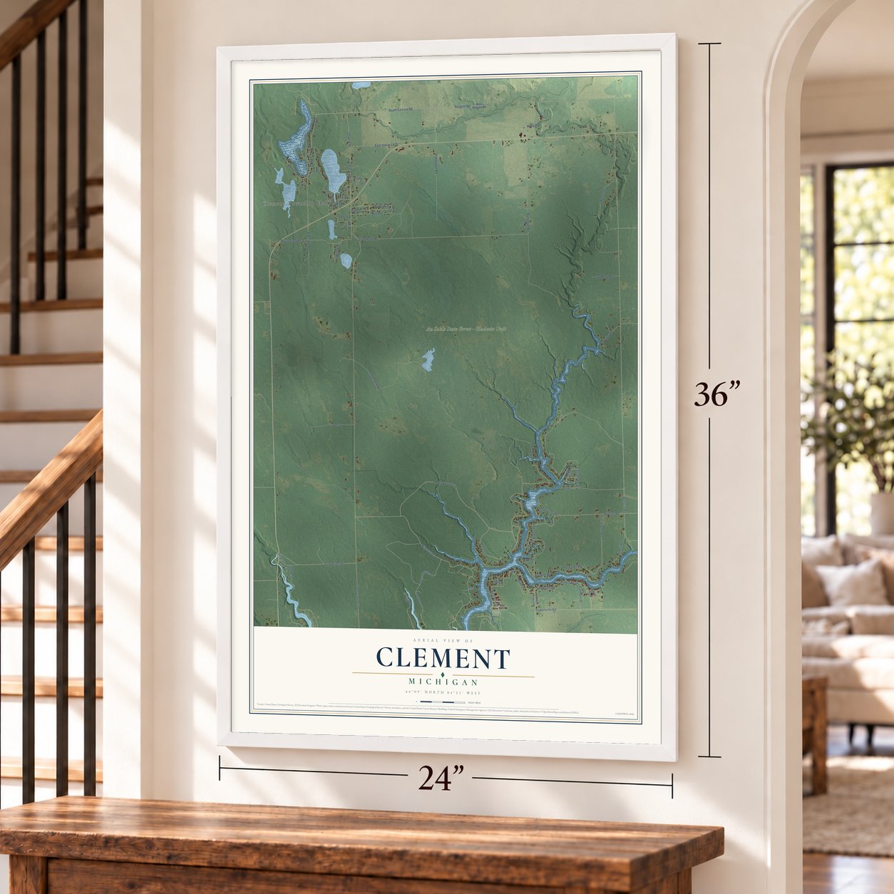Clement, Michigan map, 24 x 36 inch print in a white frame by a staircase