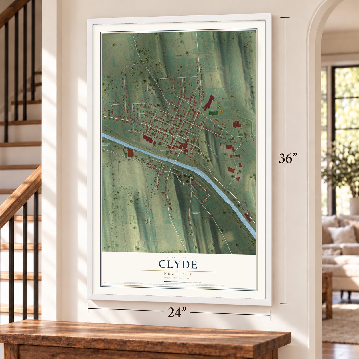 Clyde, New York map, 24 x 36 inch print in a white frame by a staircase