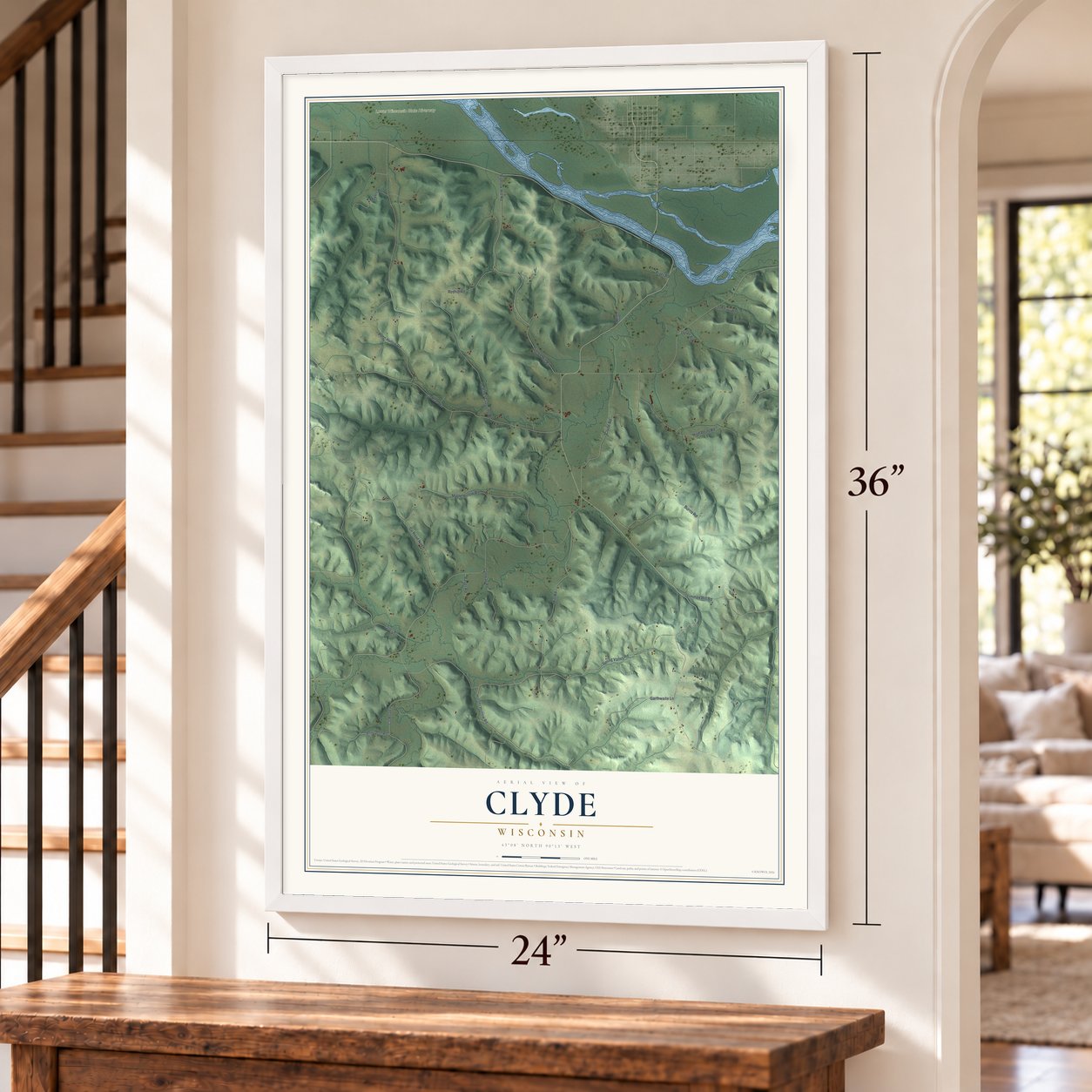 Clyde, Wisconsin map, 24 x 36 inch print in a white frame by a staircase