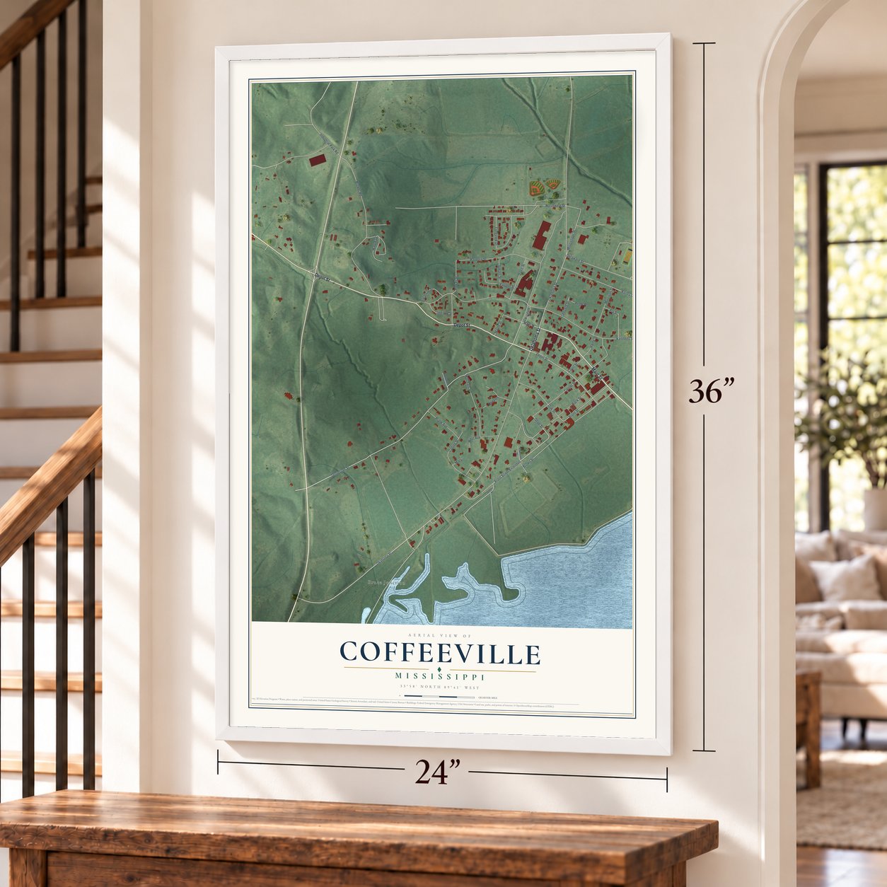 Coffeeville, Mississippi map, 24 x 36 inch print in a white frame by a staircase