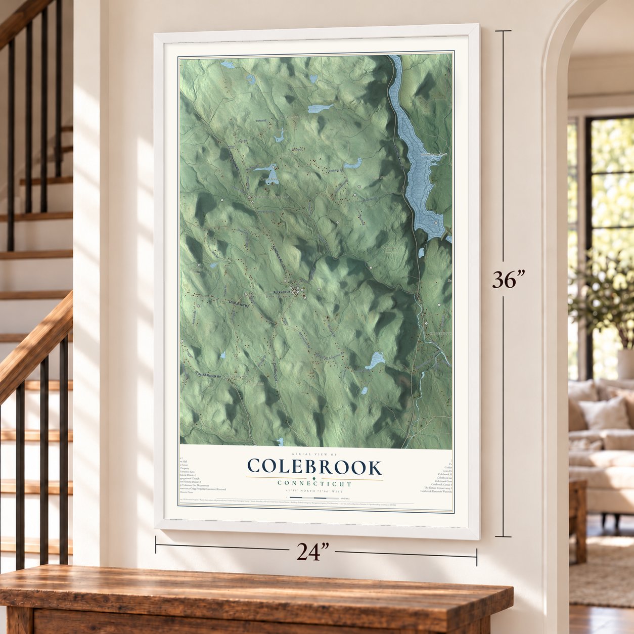 Colebrook, Connecticut map, 24 x 36 inch print in a white frame by a staircase
