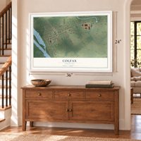 Colfax, Louisiana map, 24 x 36 inch print in a white frame above a dresser by a staircase