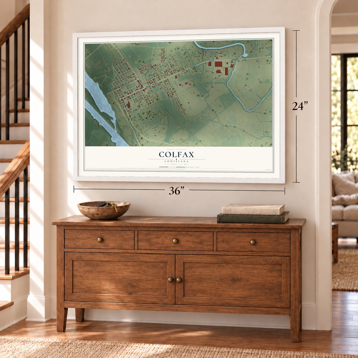 Colfax, Louisiana map, 24 x 36 inch print in a white frame above a dresser by a staircase