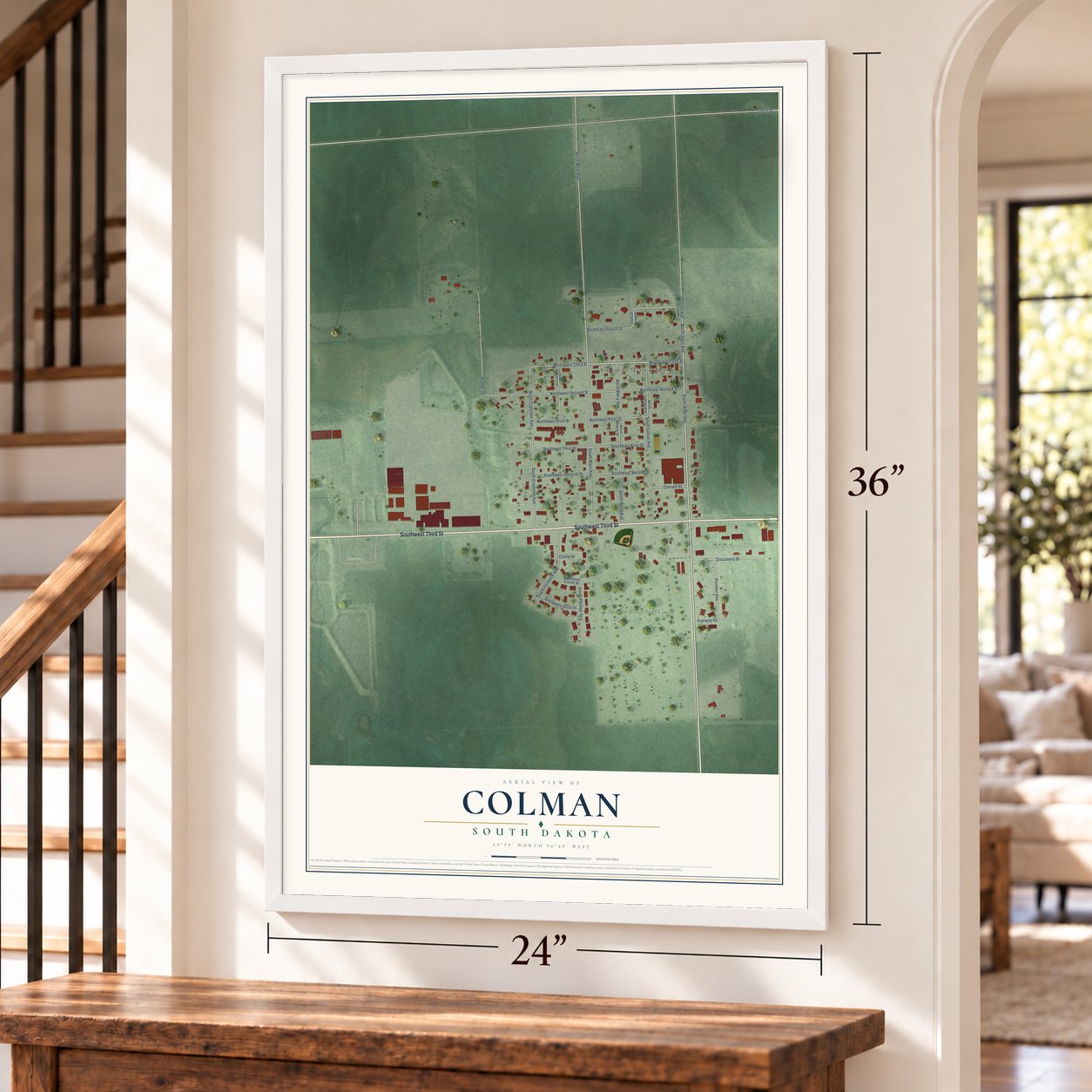 Colman, South Dakota map, 24 x 36 inch print in a white frame by a staircase
