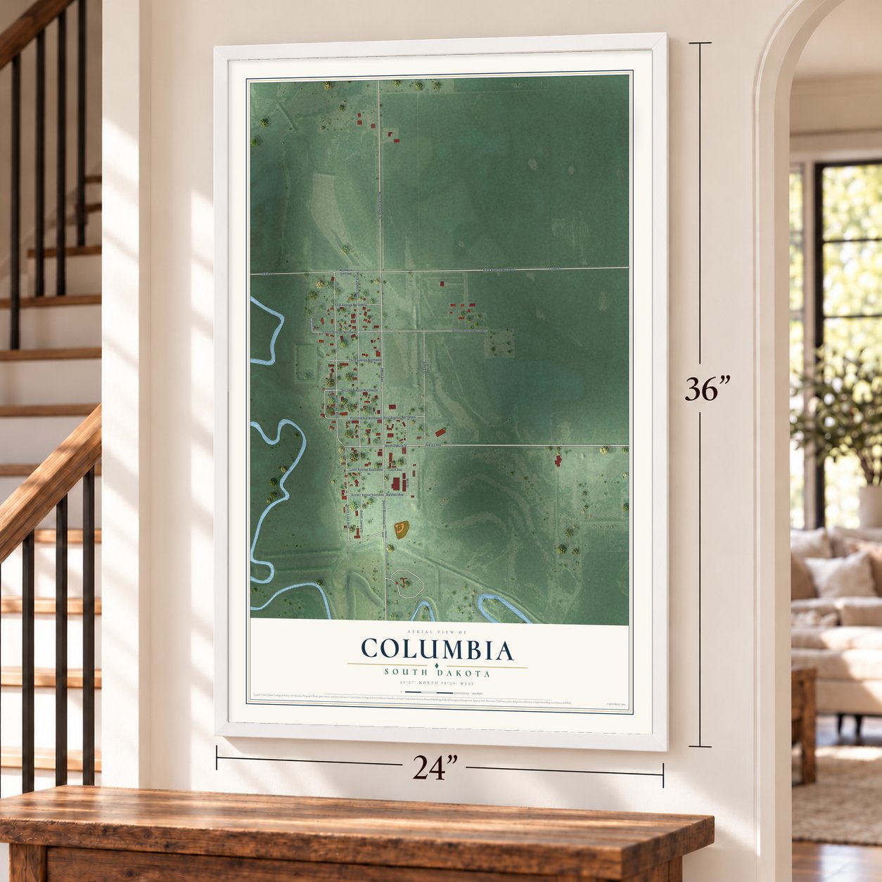 Columbia, South Dakota map, 24 x 36 inch print in a white frame by a staircase