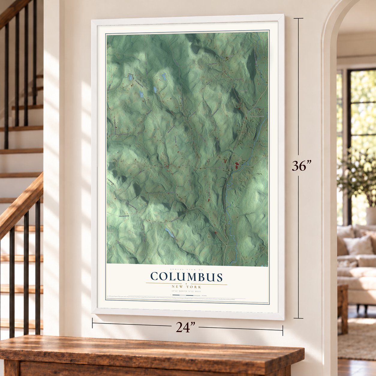 Columbus, New York map, 24 x 36 inch print in a white frame by a staircase