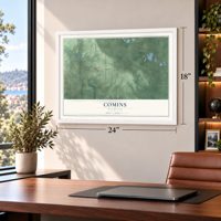 Comins, Michigan map, 18 x 24 inch print in a white frame in a home office