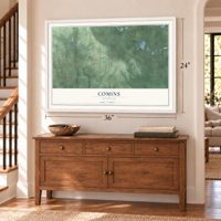 Comins, Michigan map, 24 x 36 inch print in a white frame above a dresser by a staircase