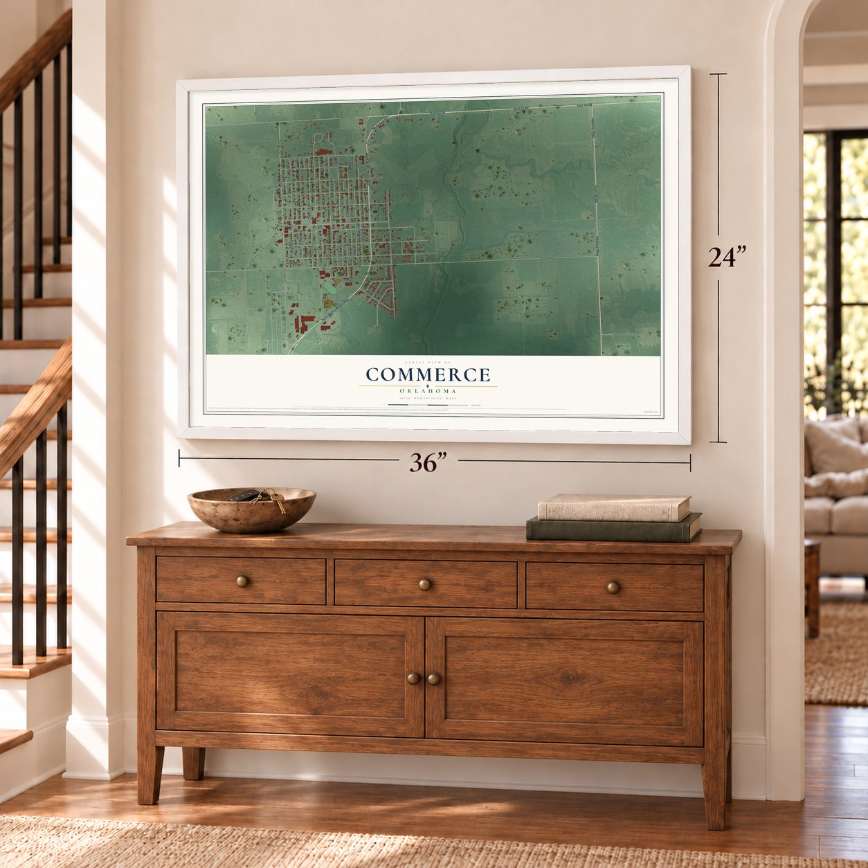 Commerce, Oklahoma map, 24 x 36 inch print in a white frame above a dresser by a staircase