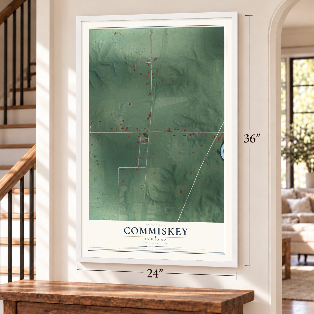 Commiskey, Indiana map, 24 x 36 inch print in a white frame by a staircase