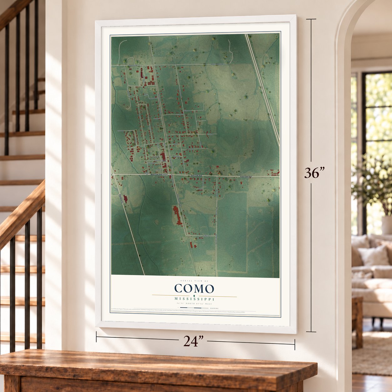 Como, Mississippi map, 24 x 36 inch print in a white frame by a staircase