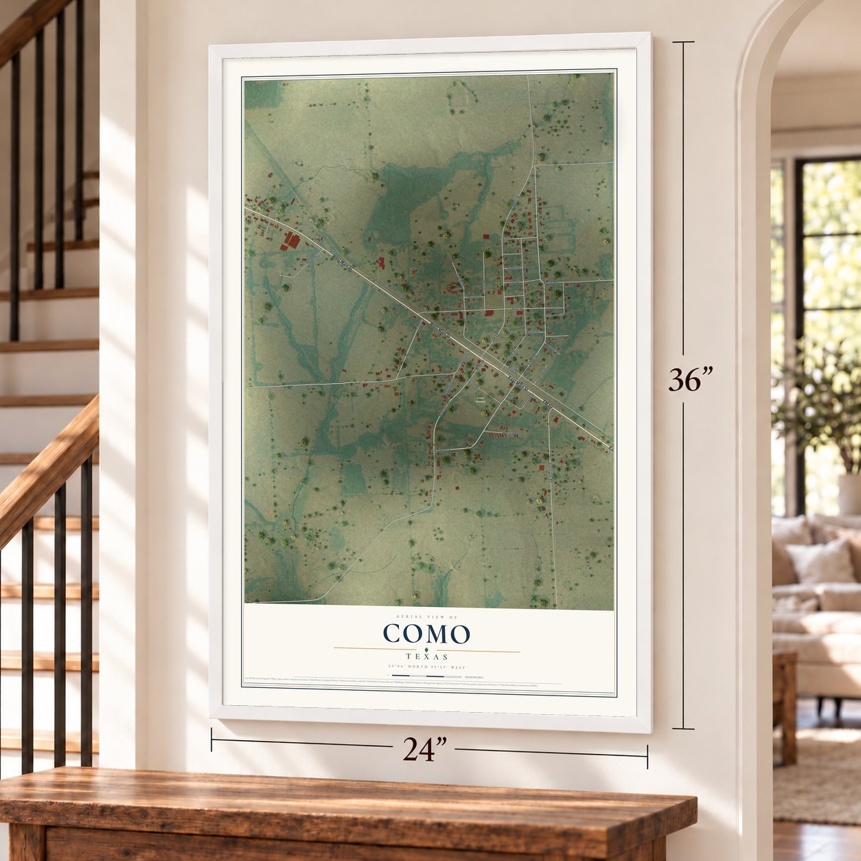 Como, Texas map, 24 x 36 inch print in a white frame by a staircase