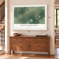 Comstock Northwest, Michigan map, 24 x 36 inch print in a white frame above a dresser by a staircase