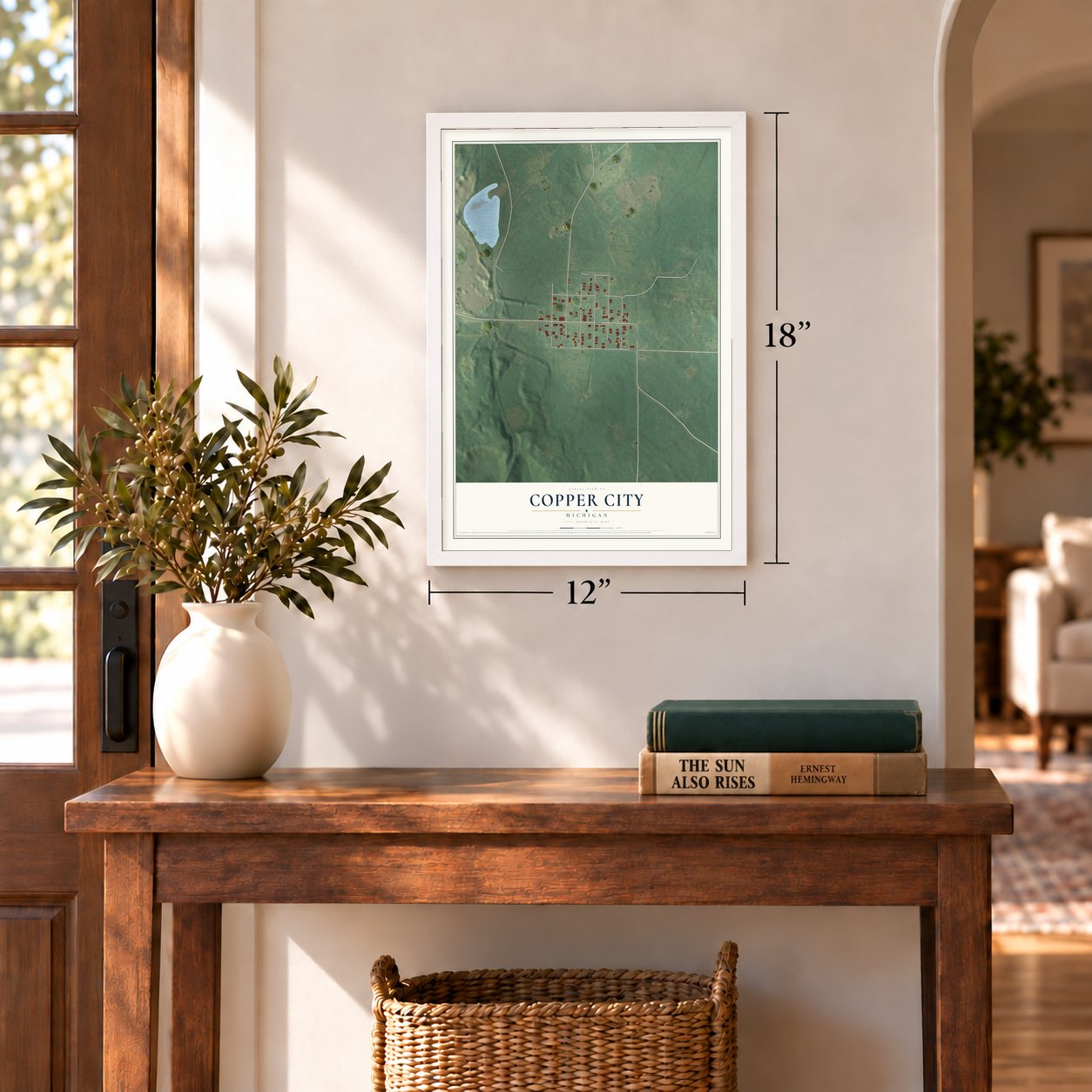 Copper City, Michigan map, 12 x 18 inch print in a white frame in an entryway