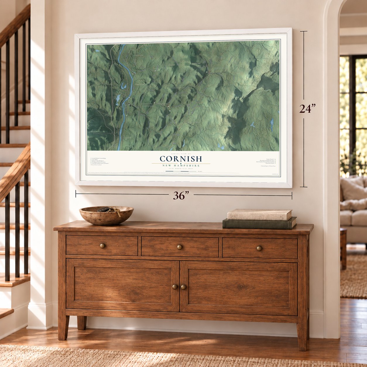 Cornish, New Hampshire map, 24 x 36 inch print in a white frame above a dresser by a staircase