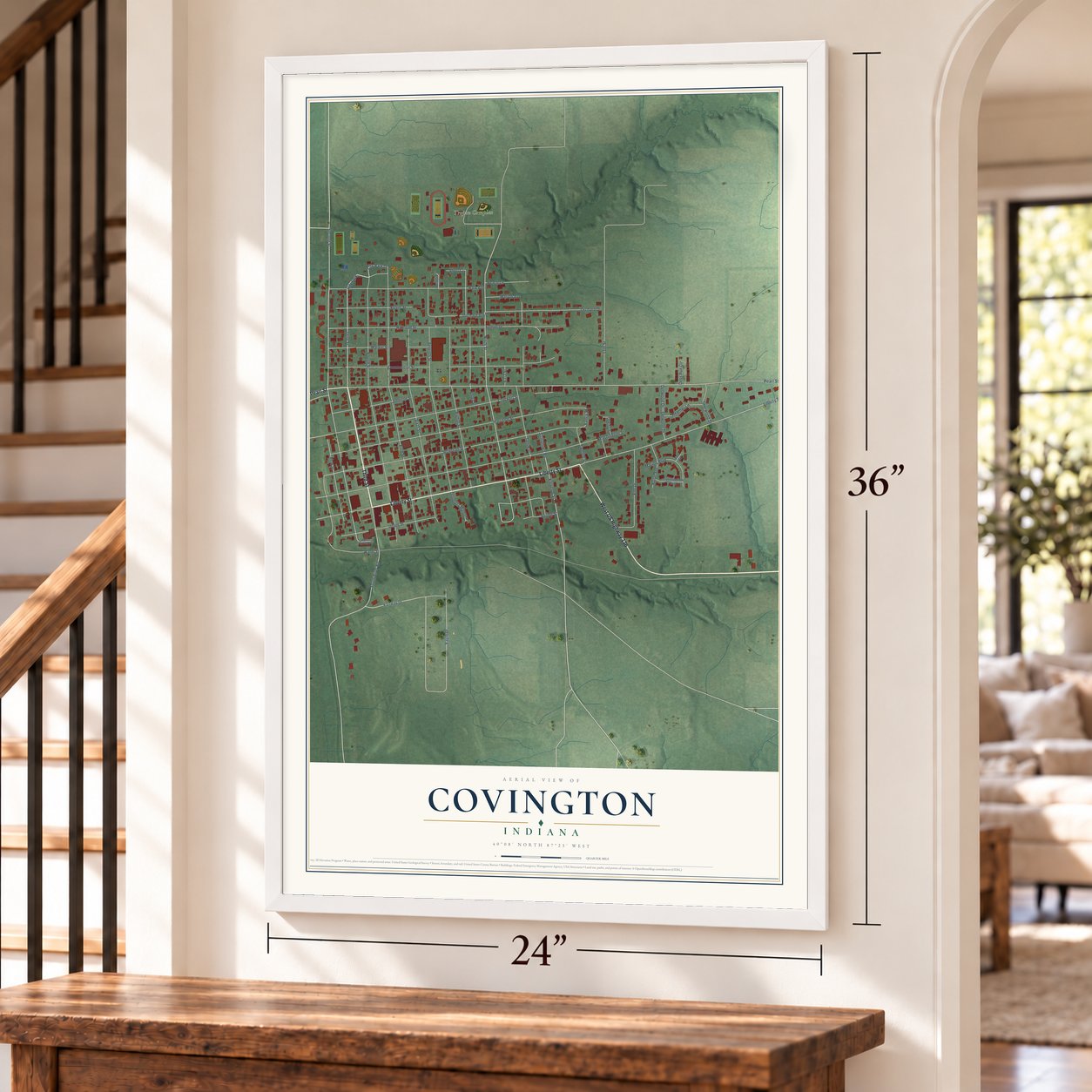 Covington, Indiana map, 24 x 36 inch print in a white frame by a staircase
