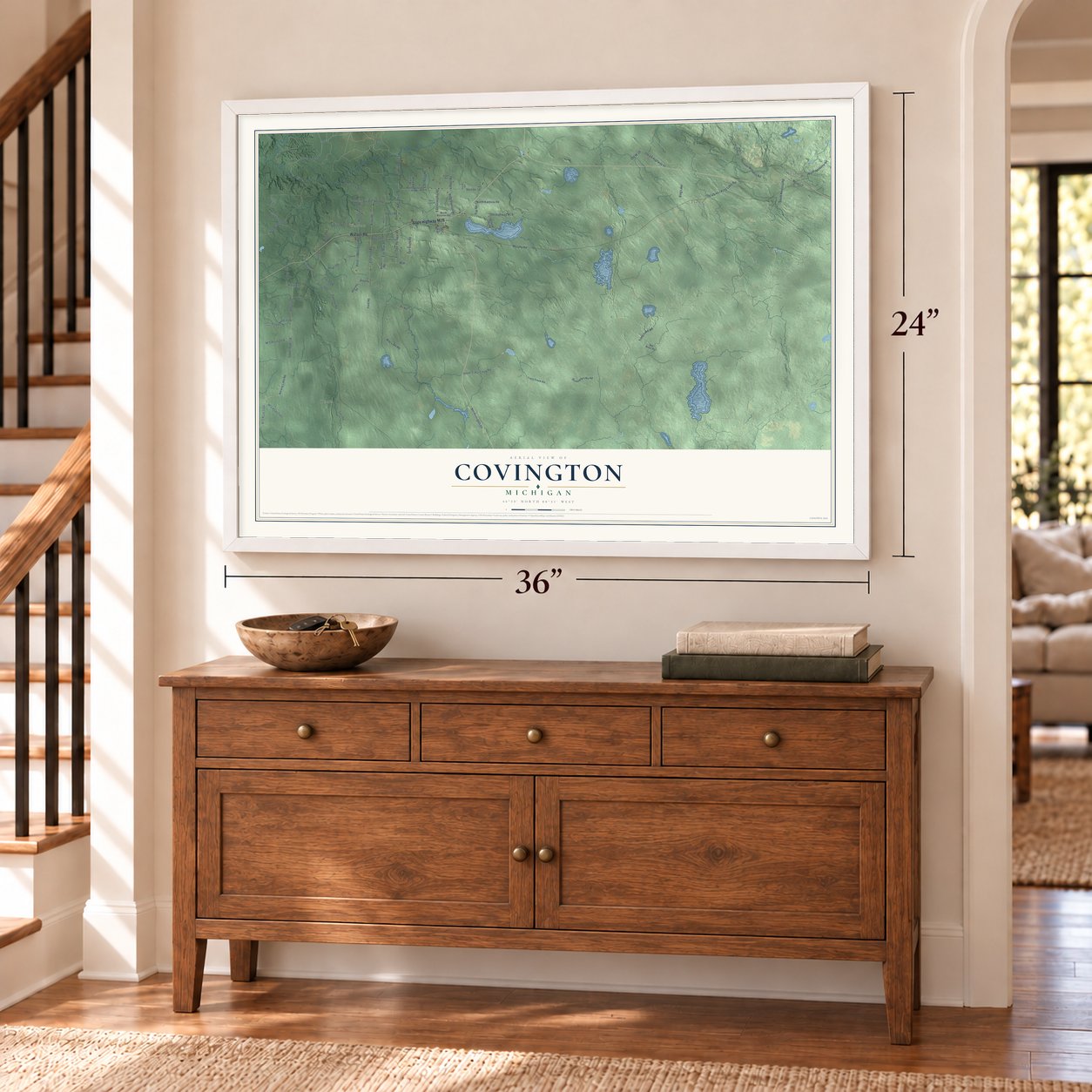 Covington, Michigan map, 24 x 36 inch print in a white frame above a dresser by a staircase