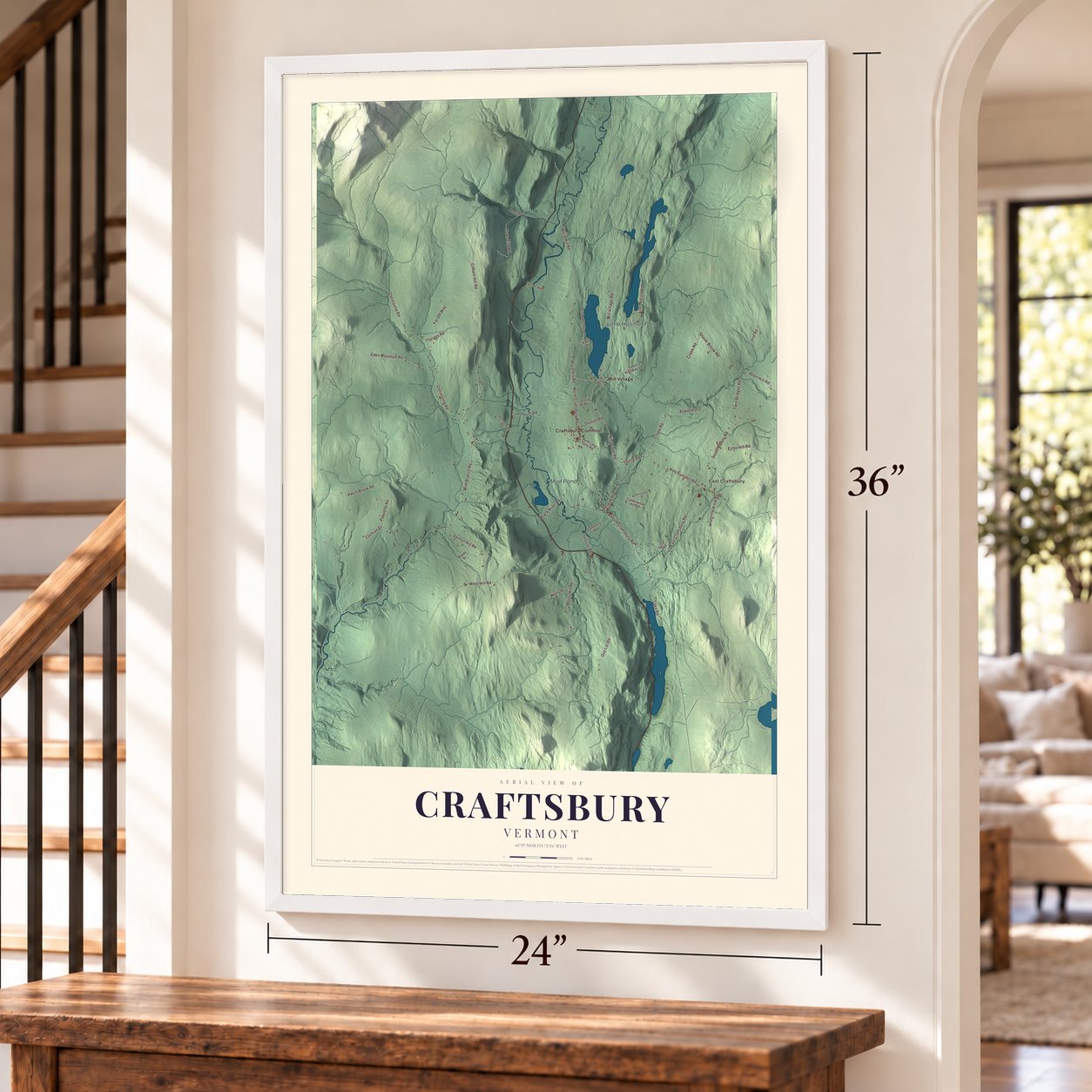 Craftsbury, Vermont map, 24 x 36 inch print in a white frame by a staircase