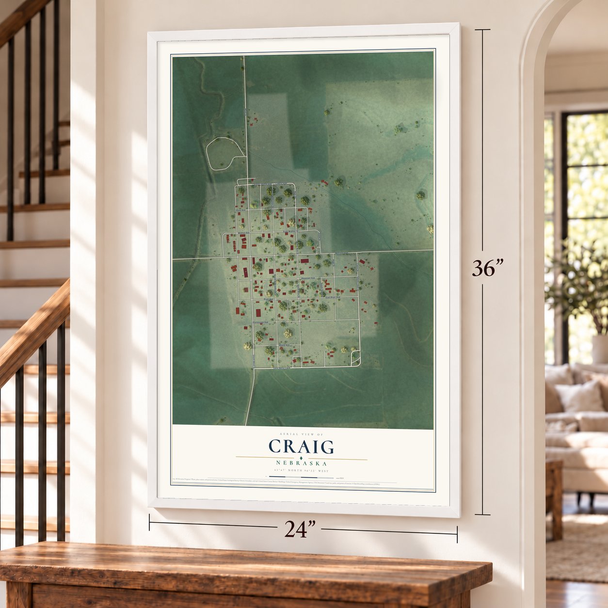 Craig, Nebraska map, 24 x 36 inch print in a white frame by a staircase