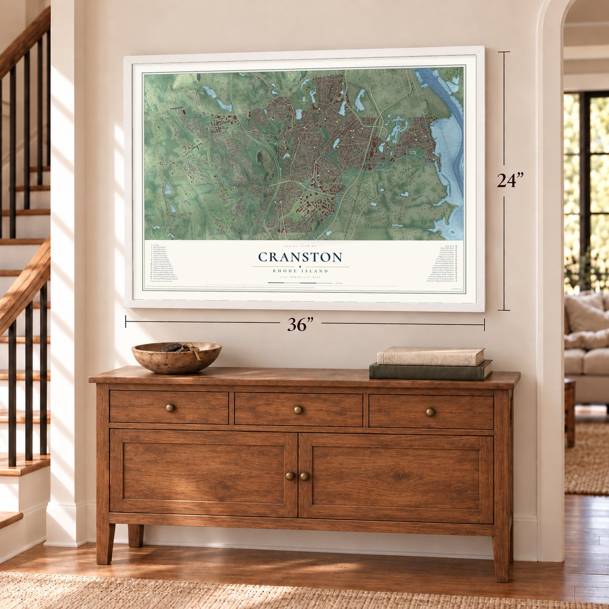Cranston, Rhode Island map, 24 x 36 inch print in a white frame above a dresser by a staircase