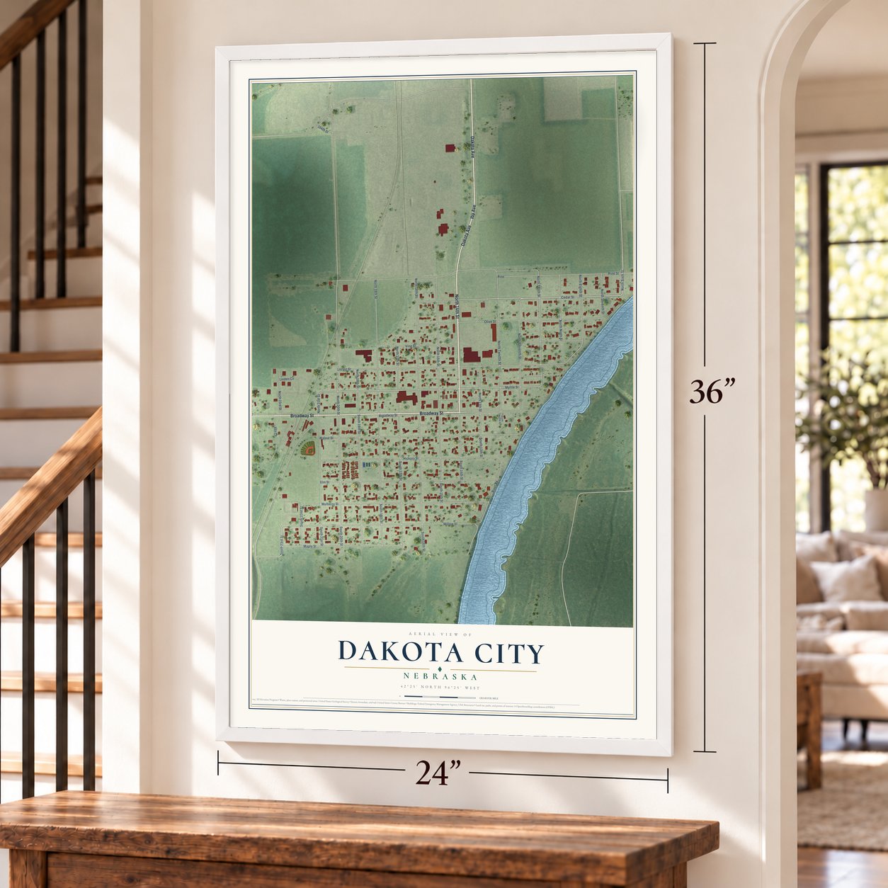 Dakota City, Nebraska map, 24 x 36 inch print in a white frame by a staircase