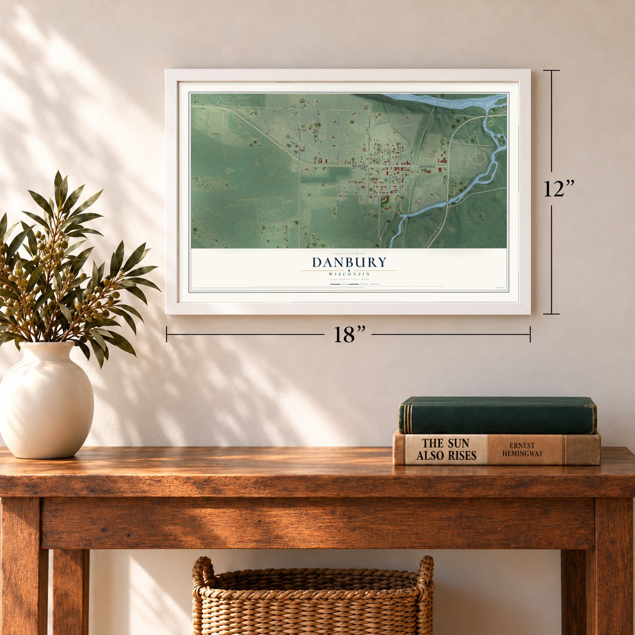 Danbury, Wisconsin map, 12 x 18 inch print in a white frame in an entryway