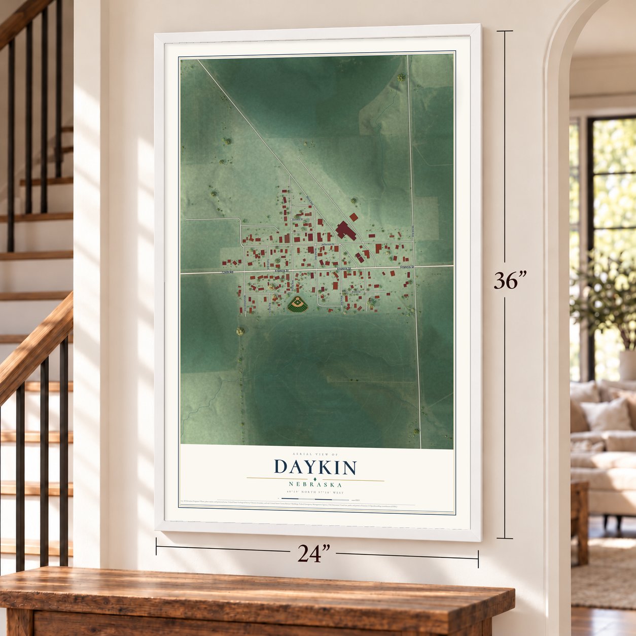 Daykin, Nebraska map, 24 x 36 inch print in a white frame by a staircase