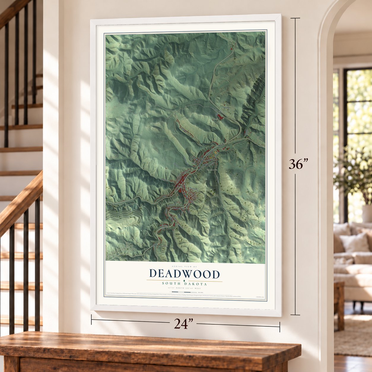 Deadwood, South Dakota map, 24 x 36 inch print in a white frame by a staircase