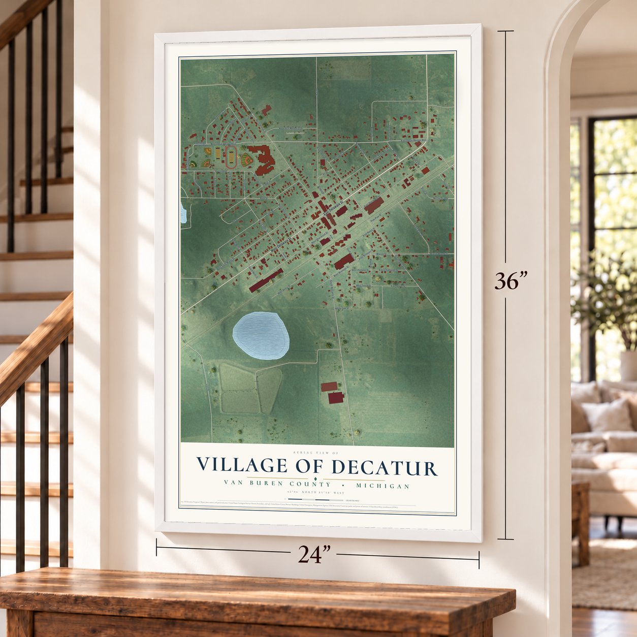 Decatur, Michigan map, 24 x 36 inch print in a white frame by a staircase