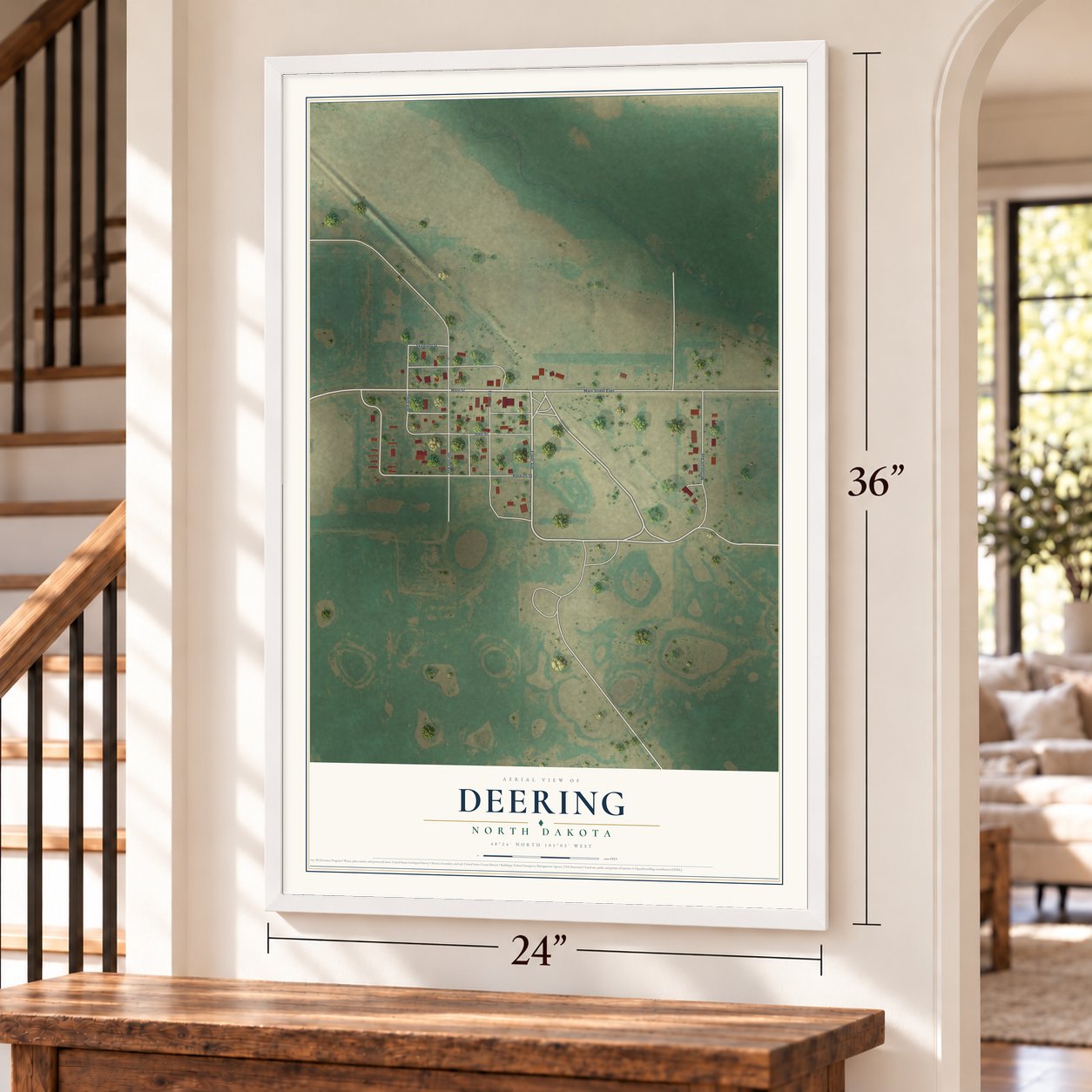 Deering, North Dakota map, 24 x 36 inch print in a white frame by a staircase