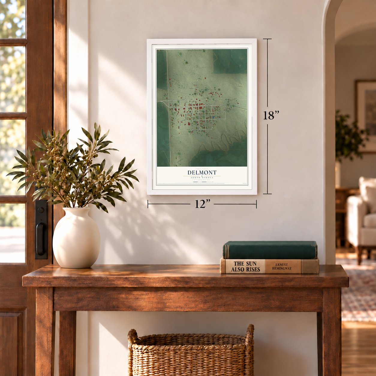 Delmont, South Dakota map, 12 x 18 inch print in a white frame in an entryway
