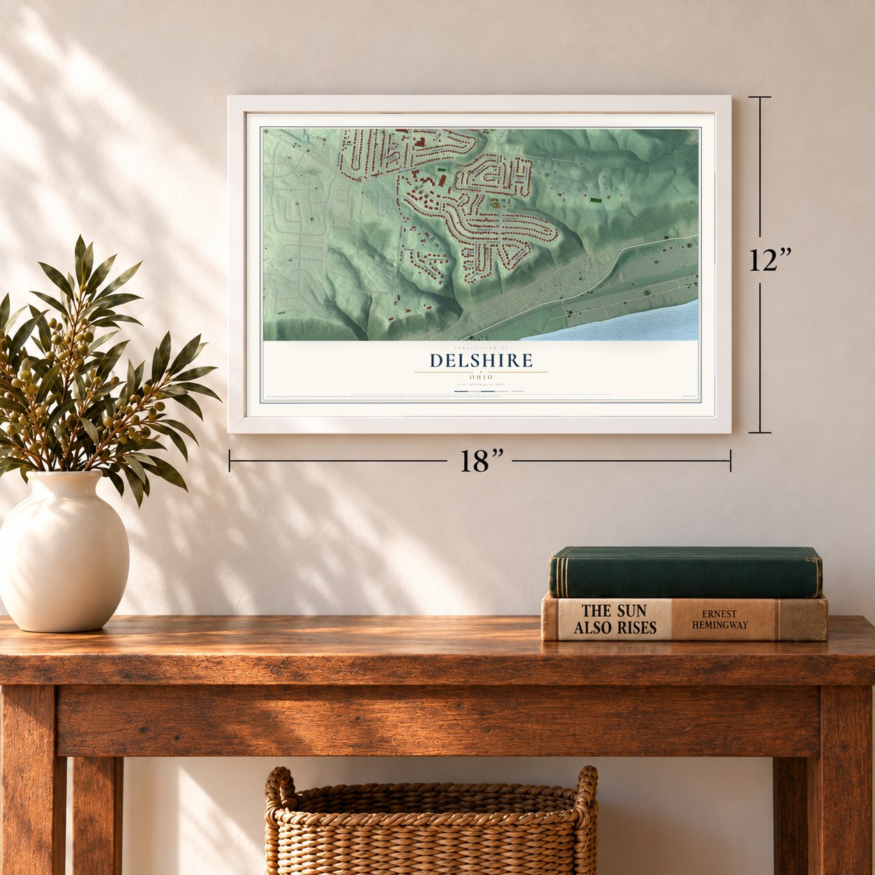 Delshire, Ohio map, 12 x 18 inch print in a white frame in an entryway