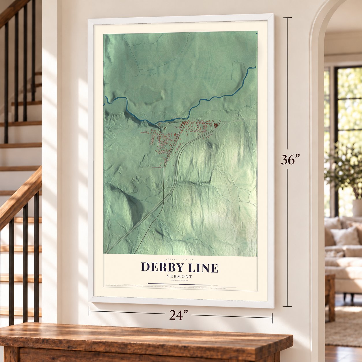 Derby Line, Vermont map, 24 x 36 inch print in a white frame by a staircase