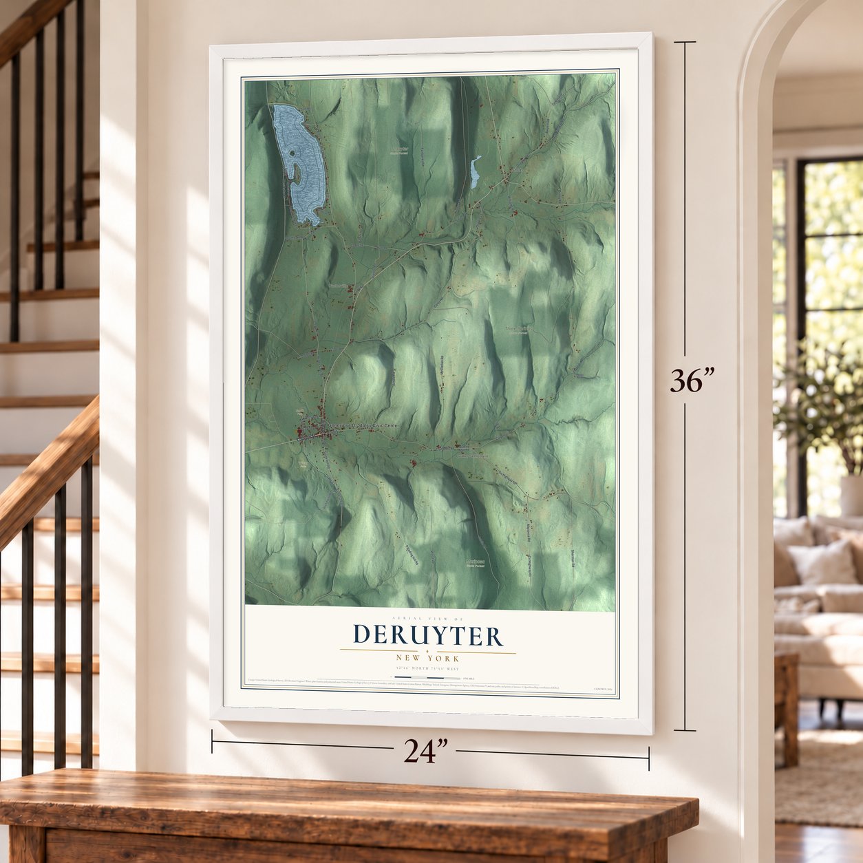 DeRuyter, New York map, 24 x 36 inch print in a white frame by a staircase