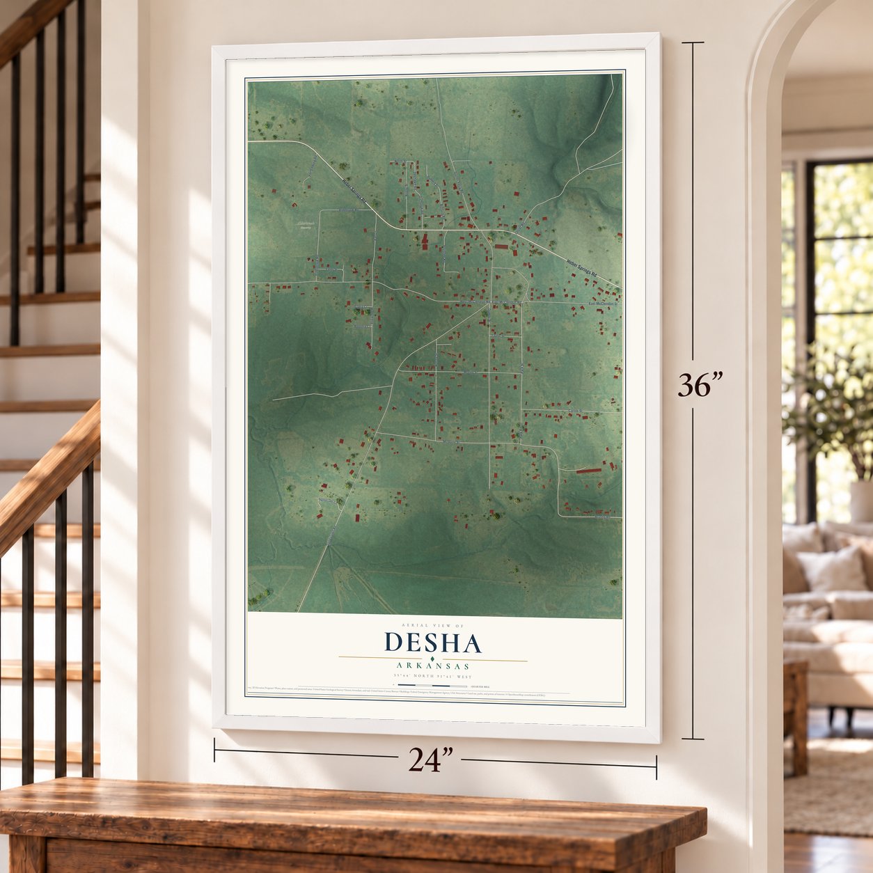 Desha, Arkansas map, 24 x 36 inch print in a white frame by a staircase