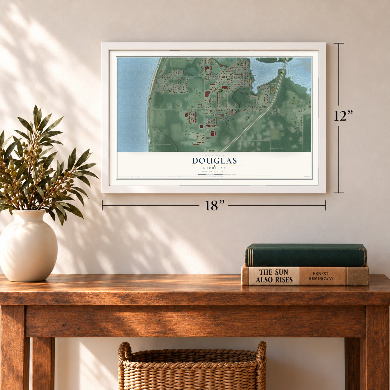Douglas, Michigan map, 12 x 18 inch print in a white frame in an entryway