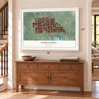Downtown, Maryland map, 24 x 36 inch print in a white frame above a dresser by a staircase