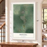Driscoll, North Dakota map, 24 x 36 inch print in a white frame by a staircase