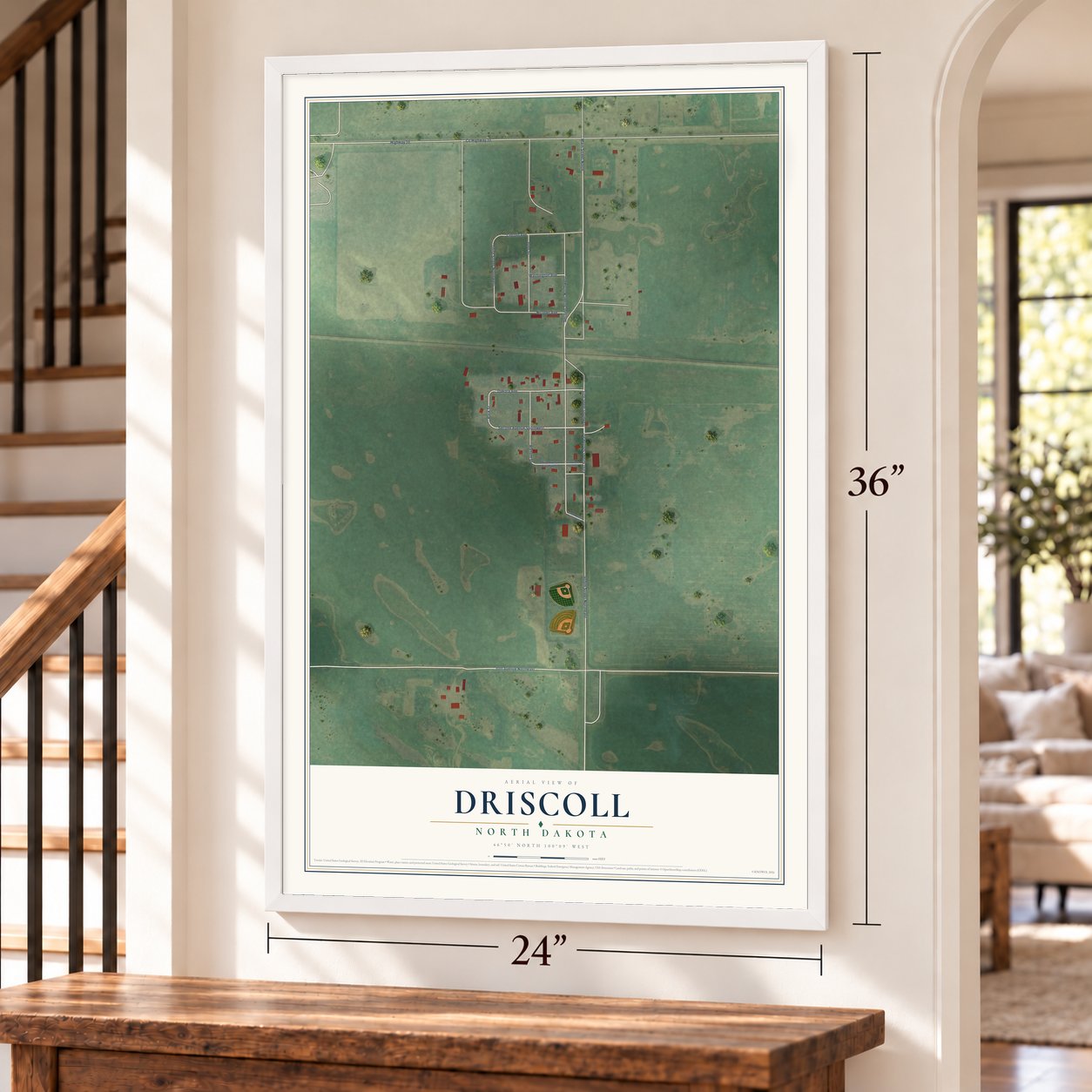 Driscoll, North Dakota map, 24 x 36 inch print in a white frame by a staircase