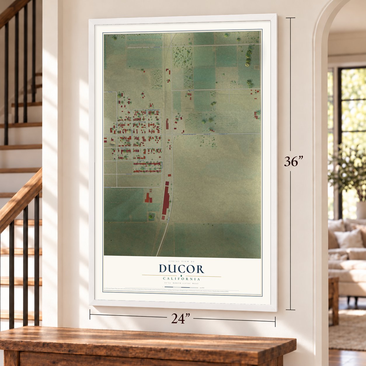 Ducor, California map, 24 x 36 inch print in a white frame by a staircase