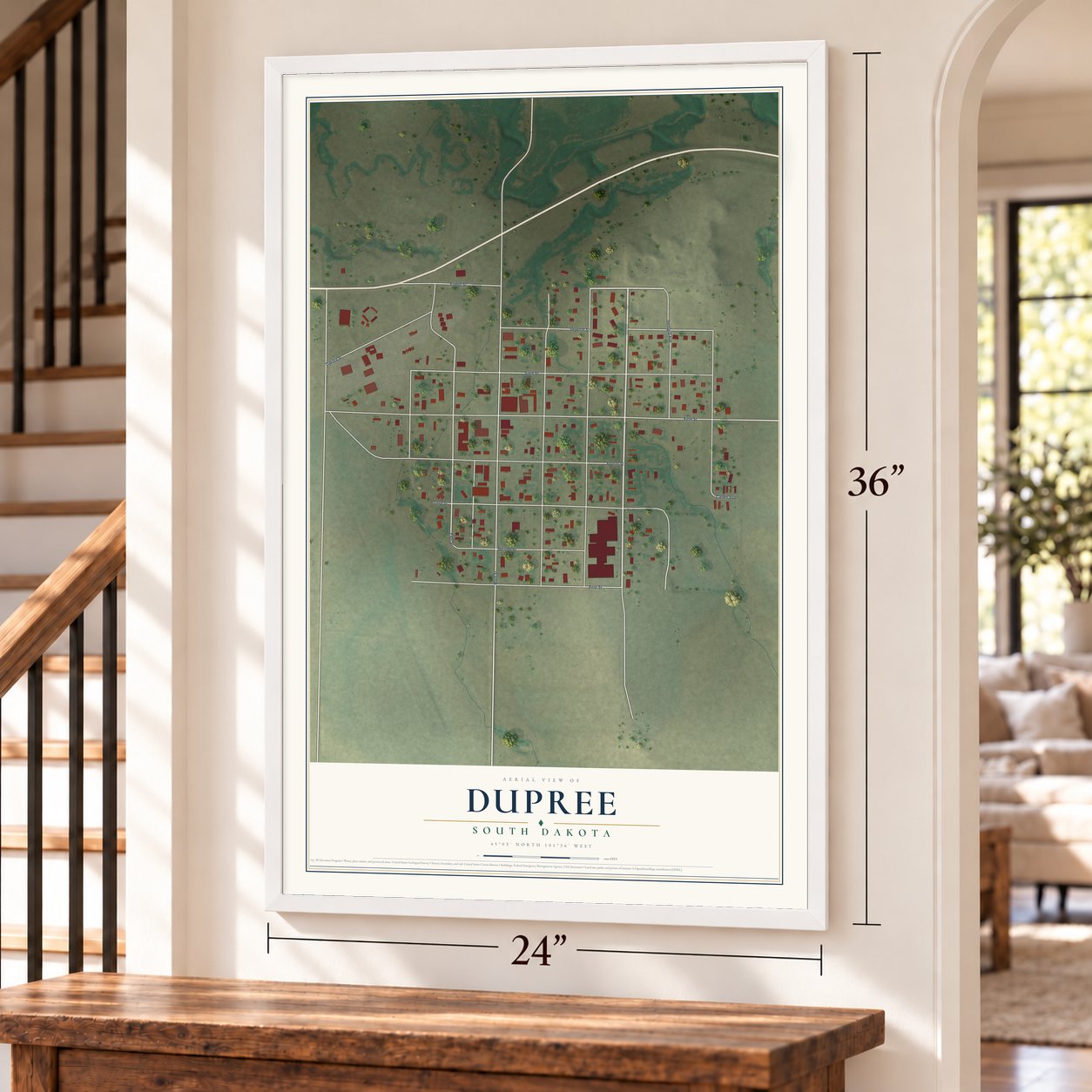Dupree, South Dakota map, 24 x 36 inch print in a white frame by a staircase