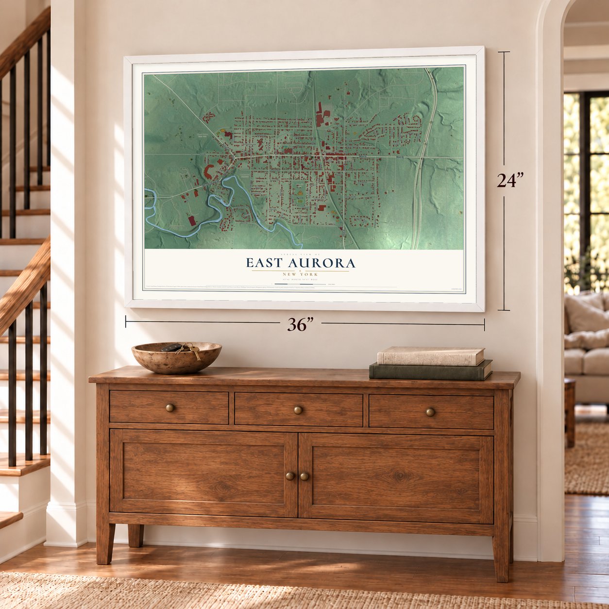 East Aurora, New York map, 24 x 36 inch print in a white frame above a dresser by a staircase