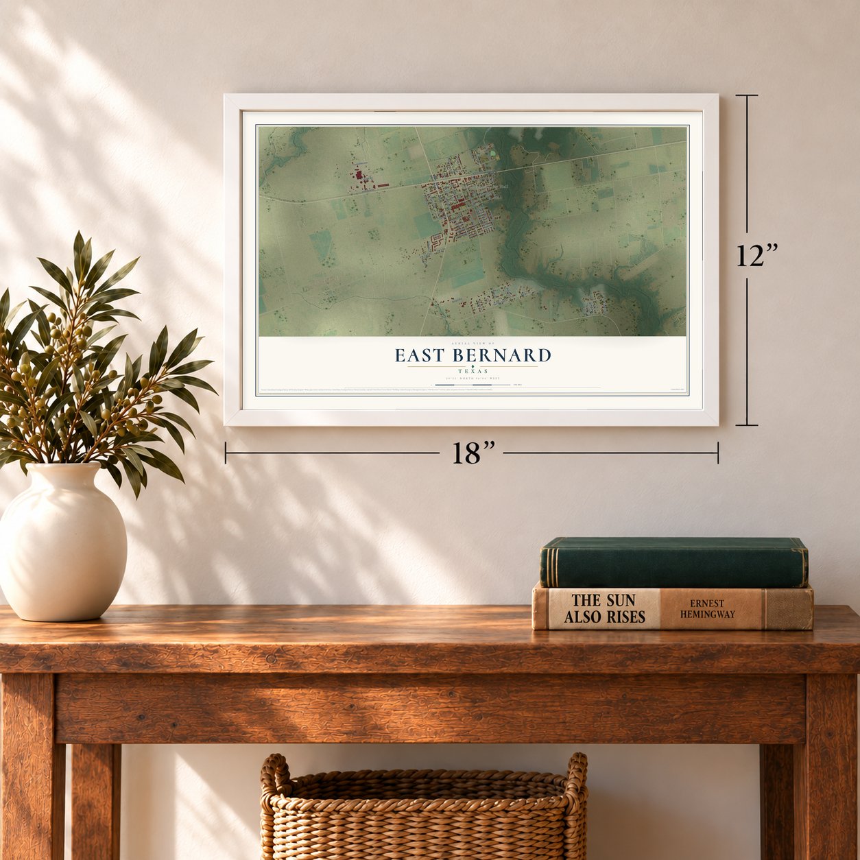East Bernard, Texas map, 12 x 18 inch print in a white frame in an entryway
