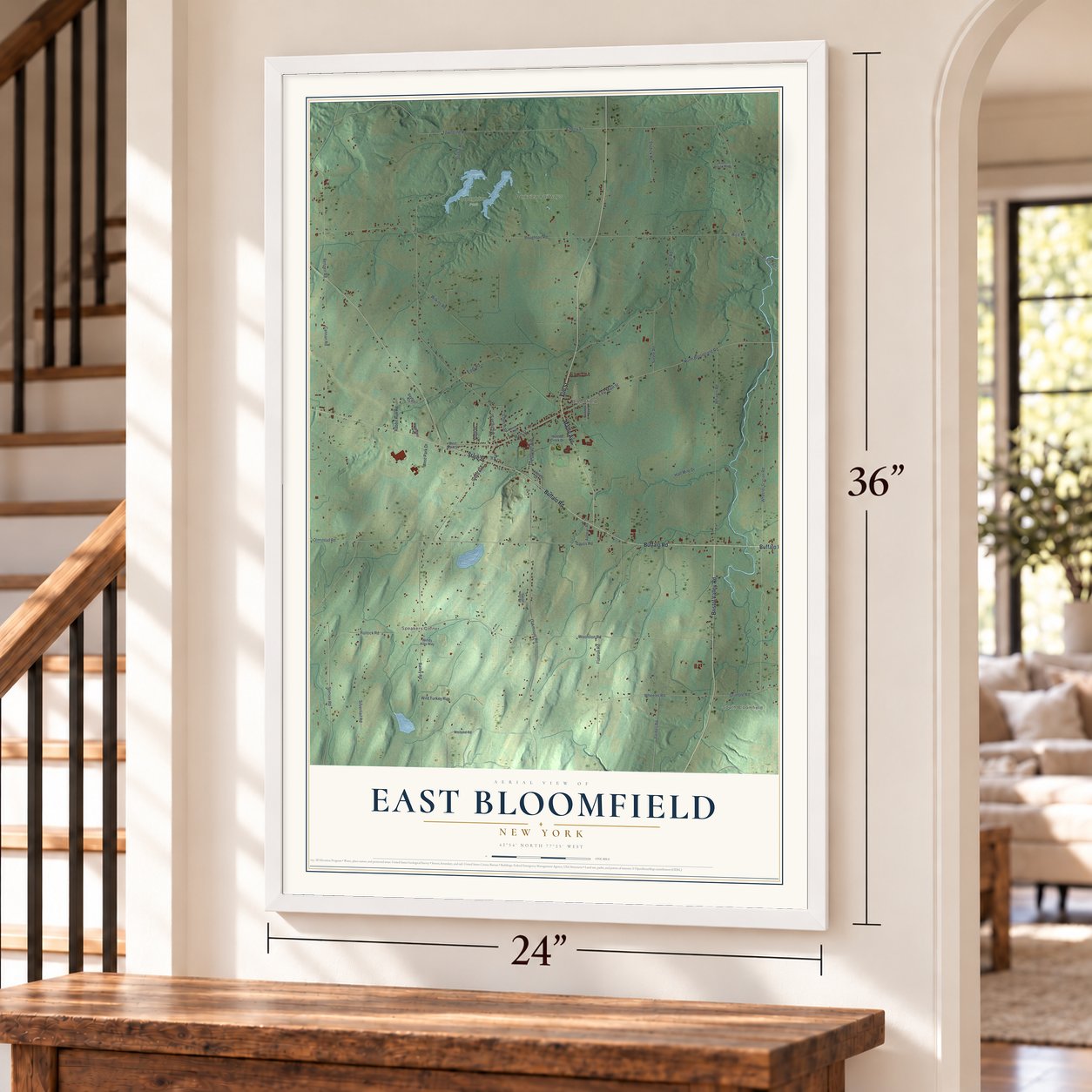 East Bloomfield, New York map, 24 x 36 inch print in a white frame by a staircase